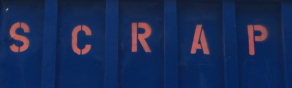 image of waste container reading "scrap" in stencil